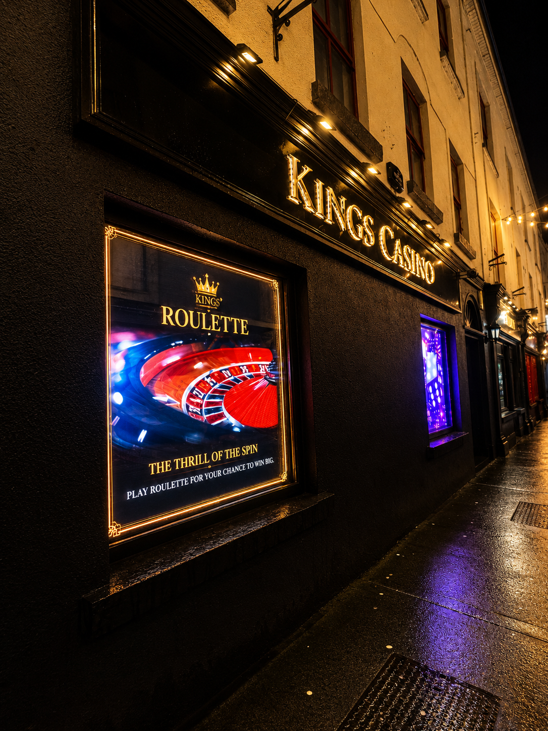 Illuminated digital displays outside Kings Casino at night